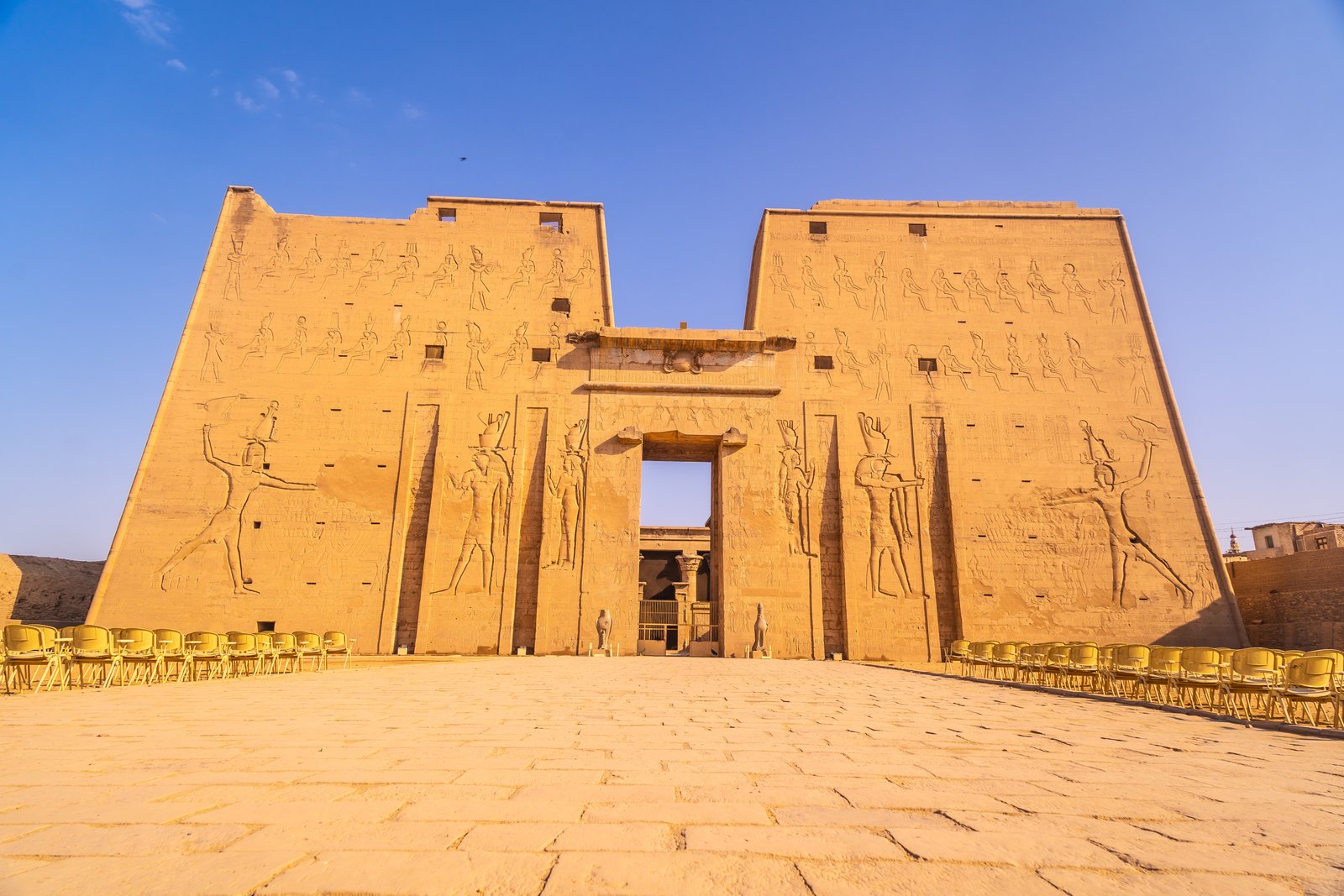 A low angle shot of the main entrance of The Temple of Horus at Edfu, Egypt